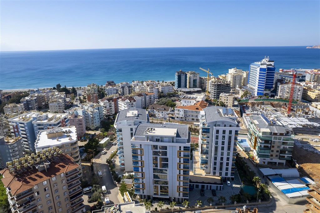 Fully furnished 1+1 apartment with sea and pool views in the Tosmur area
